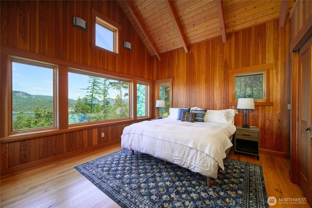 707 NW Thatcher Pass Rd, Decatur Island, WA 98221 - bedroom with wood ceiling, wooden walls, multiple windows, and beam ceiling