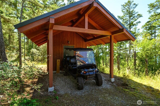707 NW Thatcher Pass Rd, Decatur Island, WA 98221 - view of parking with a carport and dirt driveway