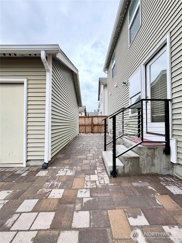 view of patio / terrace featuring fence