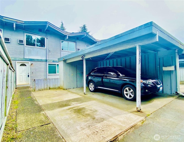 view of parking / parking lot featuring a carport