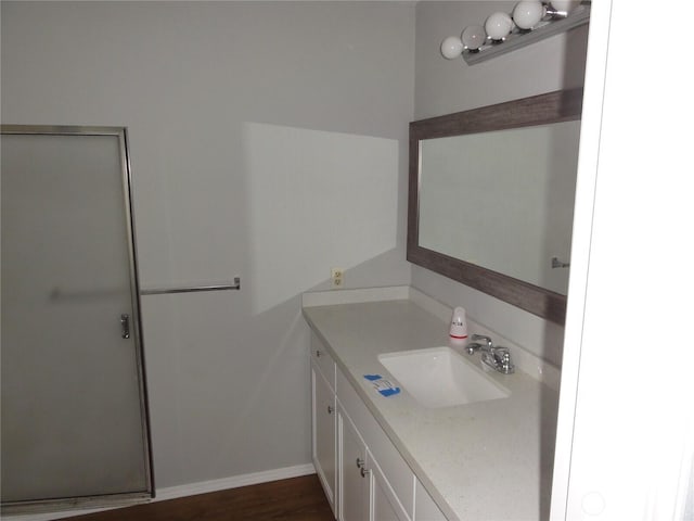 bathroom featuring baseboards and vanity