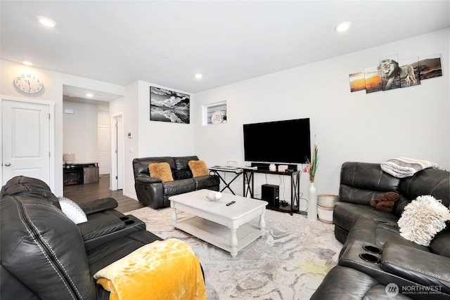 living room with recessed lighting and wood finished floors