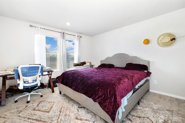 bedroom featuring carpet floors and baseboards