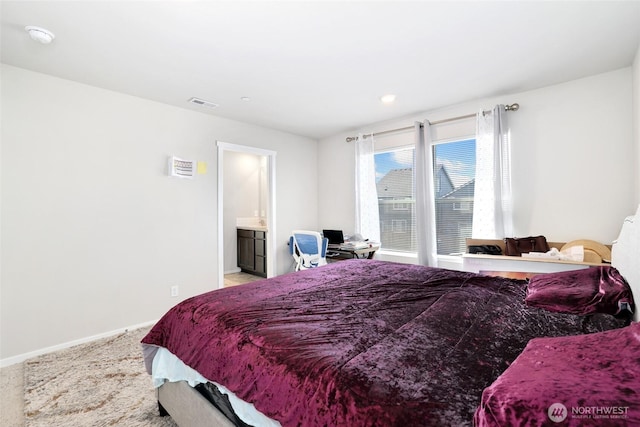 bedroom with visible vents and baseboards