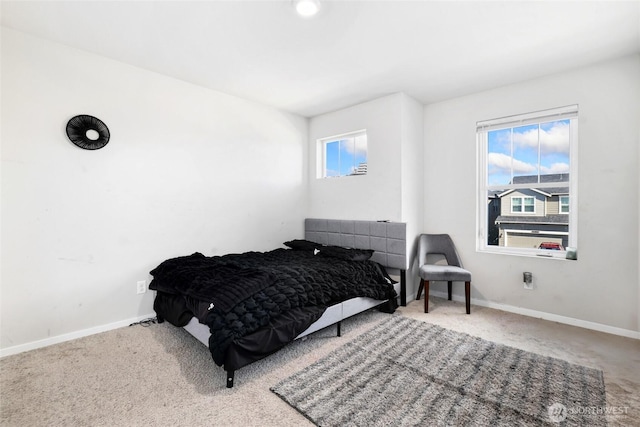 carpeted bedroom with baseboards