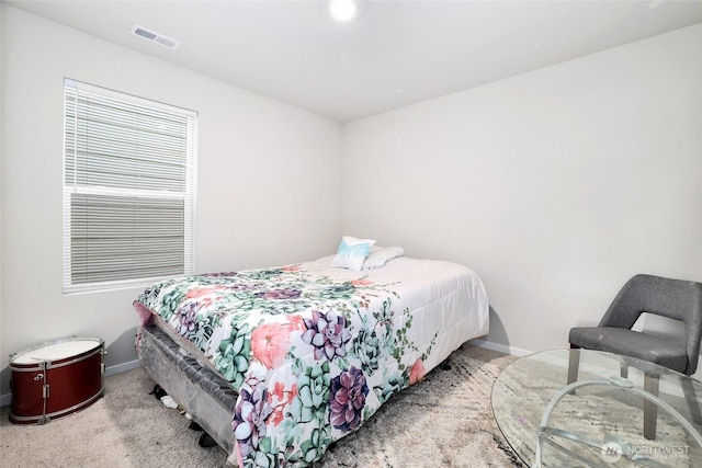 bedroom with carpet flooring, baseboards, and visible vents