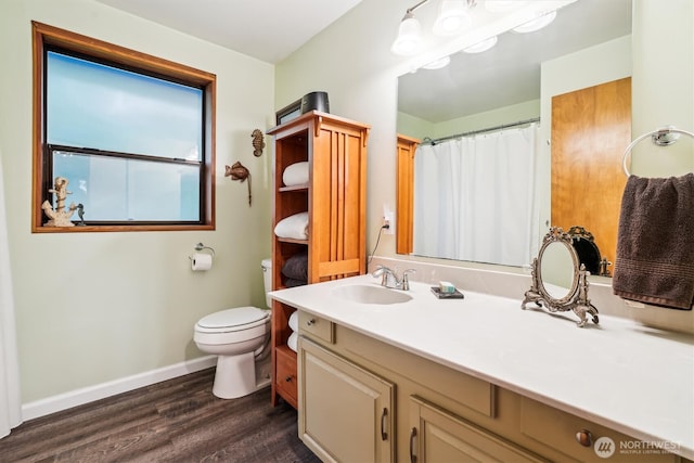 10209 Edgewood Dr, Anderson Island, WA 98303 - full bath with baseboards, a shower with shower curtain, toilet, wood finished floors, and vanity
