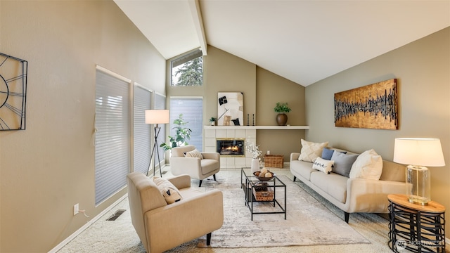 living room with high vaulted ceiling, carpet floors, visible vents, beam ceiling, and a tiled fireplace