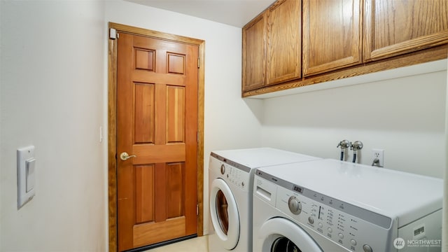 laundry area with cabinet space and washing machine and clothes dryer