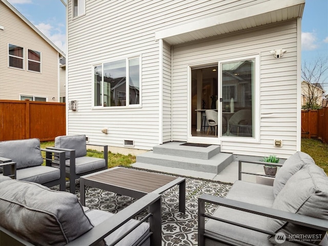 view of patio featuring outdoor lounge area and fence