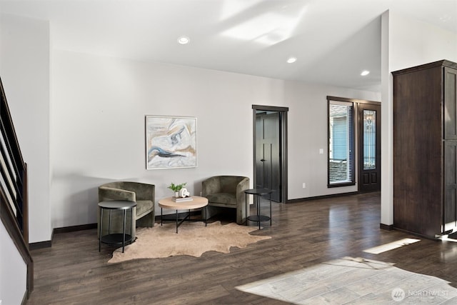 sitting room with lofted ceiling, baseboards, wood finished floors, and recessed lighting