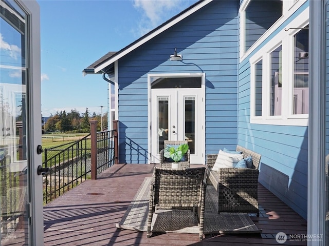 wooden deck featuring french doors