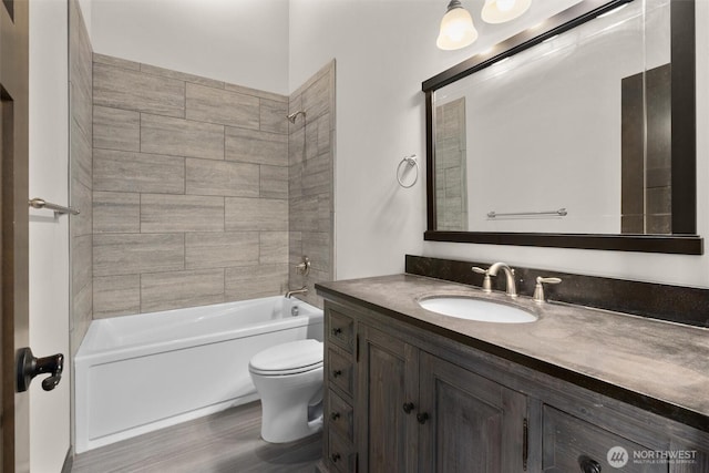 full bath featuring shower / washtub combination, vanity, and toilet