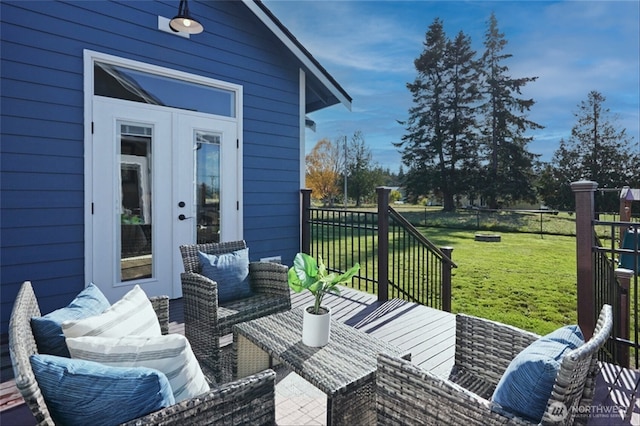 deck with french doors, a lawn, an outdoor living space, and fence