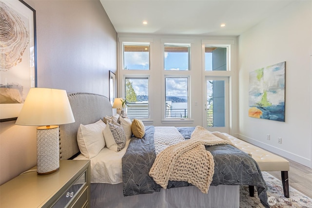 bedroom featuring recessed lighting, baseboards, and wood finished floors