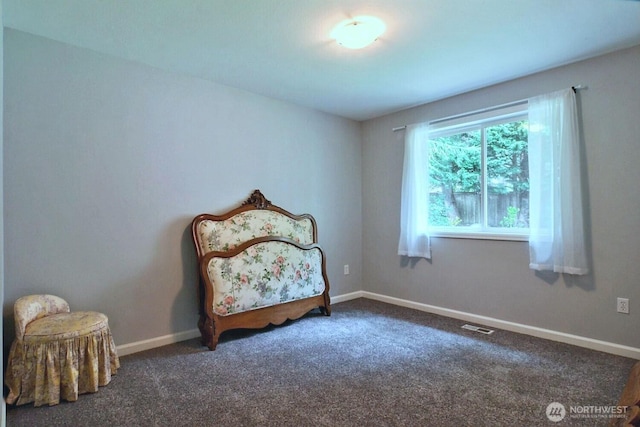 carpeted bedroom featuring visible vents and baseboards