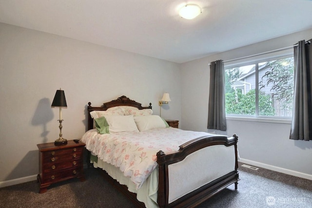 carpeted bedroom with baseboards and visible vents