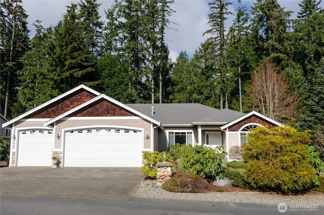 single story home with a garage and driveway