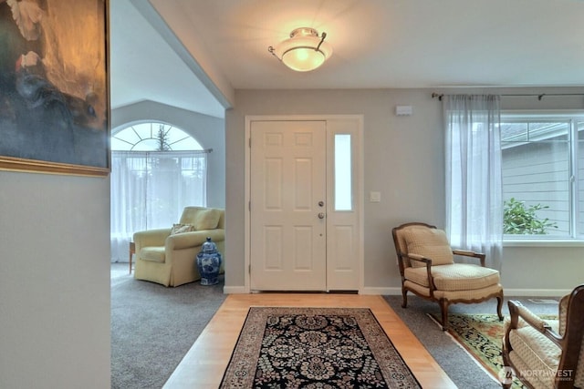 entryway with light wood-style flooring and baseboards