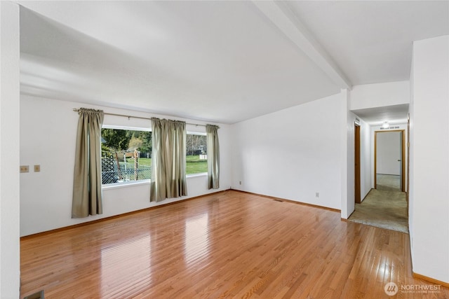 2308 Vista Ln, Anacortes, WA 98221 - unfurnished room featuring light wood finished floors, beam ceiling, and baseboards