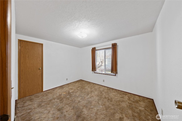 2308 Vista Ln, Anacortes, WA 98221 - spare room featuring carpet floors and a textured ceiling