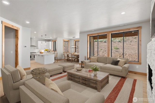 660 Stone Ridge Dr, Cle Elum, WA 98922 - living area with light wood-style floors, recessed lighting, visible vents, and a stone fireplace