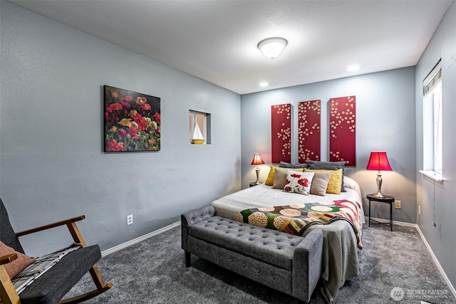 carpeted bedroom with baseboards