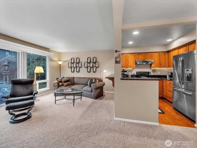 living room with light carpet, baseboards, and recessed lighting