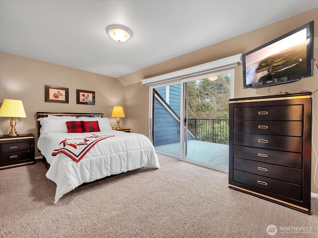 bedroom with access to outside and carpet flooring