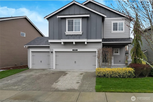 view of front facade featuring driveway, a shingled roof, an attached garage, a front lawn, and board and batten siding