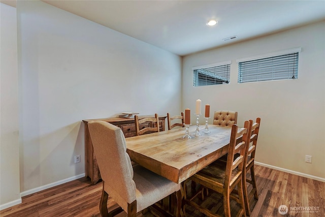 dining space featuring baseboards, visible vents, wood finished floors, and recessed lighting