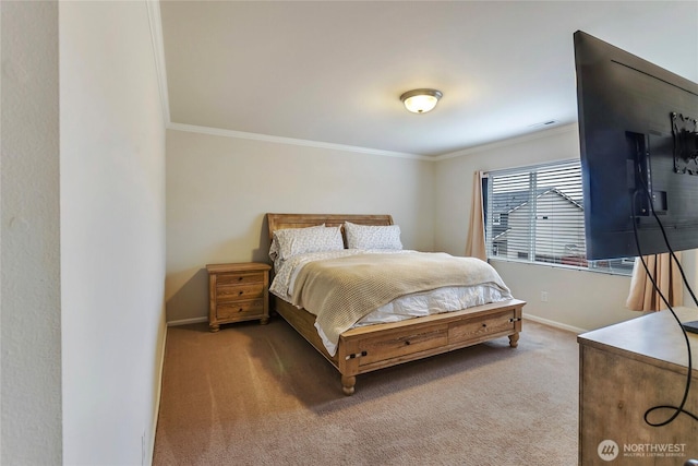 bedroom featuring carpet flooring, crown molding, and baseboards