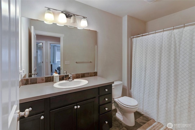 bathroom with a shower with curtain, vanity, and toilet