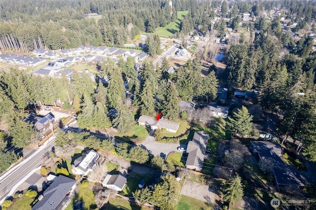 aerial view with a residential view and a wooded view