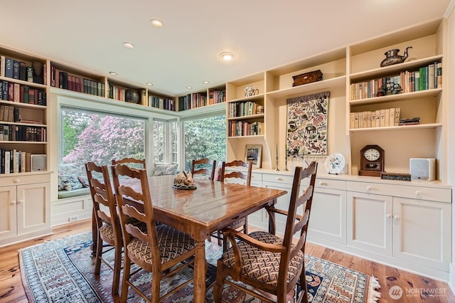 dining space featuring recessed lighting and light wood finished floors