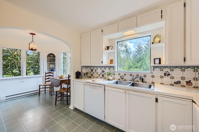 kitchen with arched walkways, a baseboard radiator, a sink, dishwasher, and open shelves