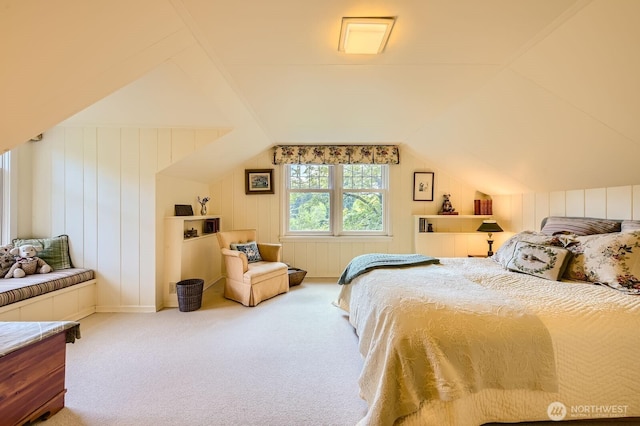 carpeted bedroom with vaulted ceiling