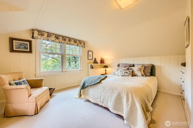 bedroom with lofted ceiling and carpet