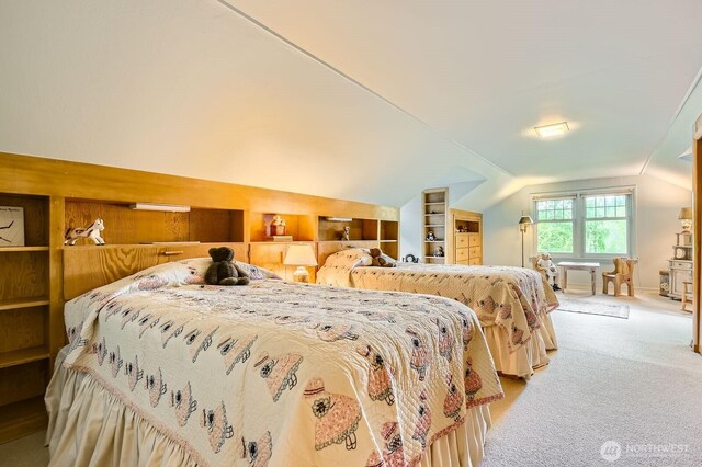 bedroom with light carpet and lofted ceiling