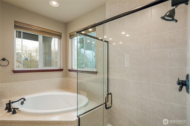 full bathroom featuring a stall shower, a garden tub, and recessed lighting