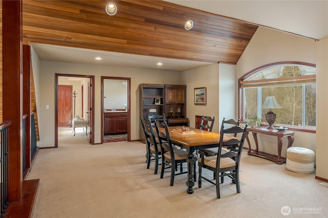 dining space with recessed lighting, lofted ceiling, wood ceiling, light carpet, and baseboards