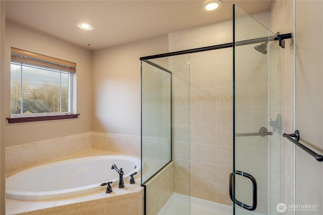 full bath with recessed lighting, a garden tub, and a shower stall