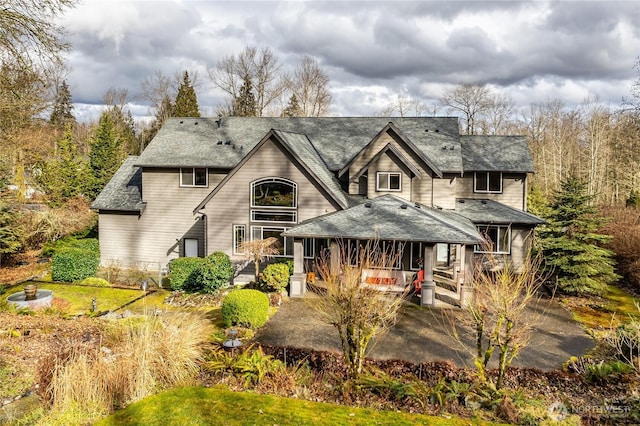 view of front of home featuring a shingled roof