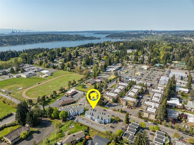 birds eye view of property featuring a water view