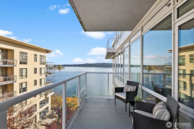 balcony featuring a water view