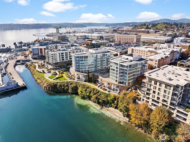 drone / aerial view featuring a water view and a city view