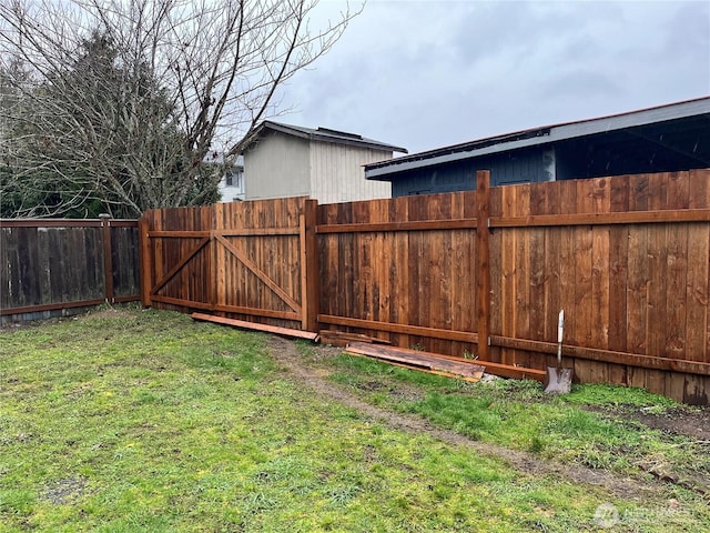 view of yard with a gate and fence