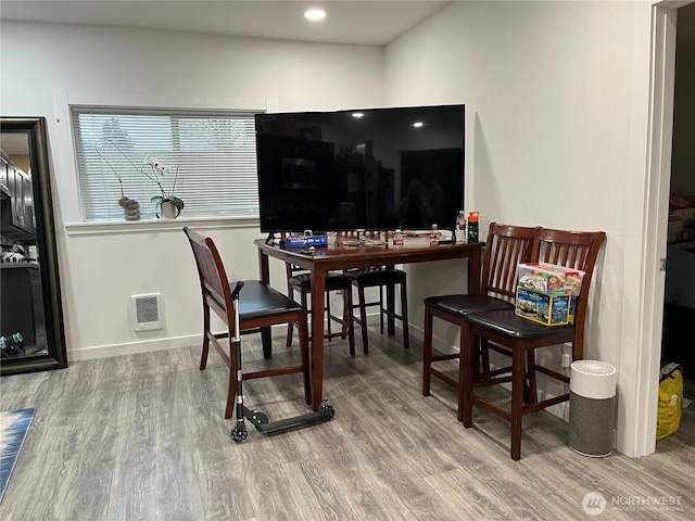 interior space featuring recessed lighting, visible vents, baseboards, and wood finished floors