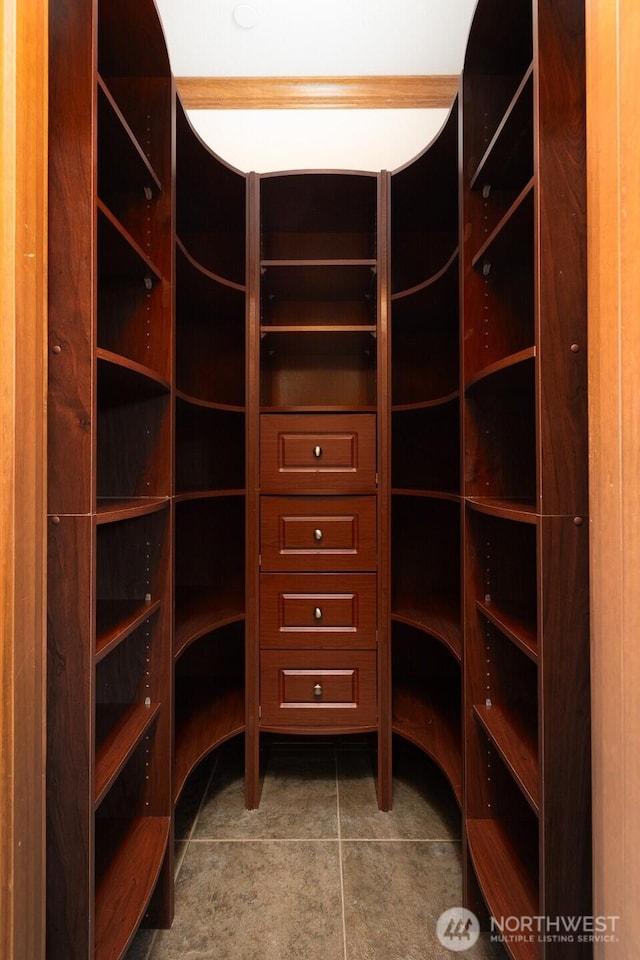 spacious closet featuring tile patterned floors