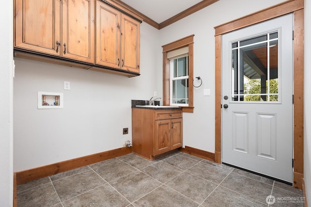 clothes washing area featuring washer hookup, baseboards, cabinet space, electric dryer hookup, and crown molding